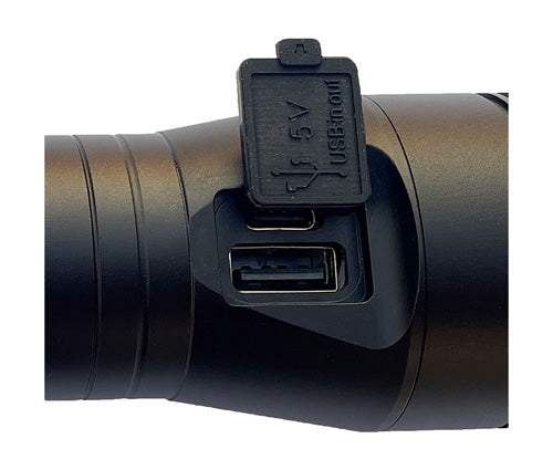 Close-up of USB port and cover on the back of the flashlight on a white background
