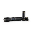 Black flashlight with two batteries on a white background