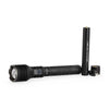 Black LED flashlight and rechargeable battery on a white background