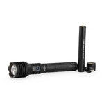 Black LED flashlight and rechargeable battery on a white background